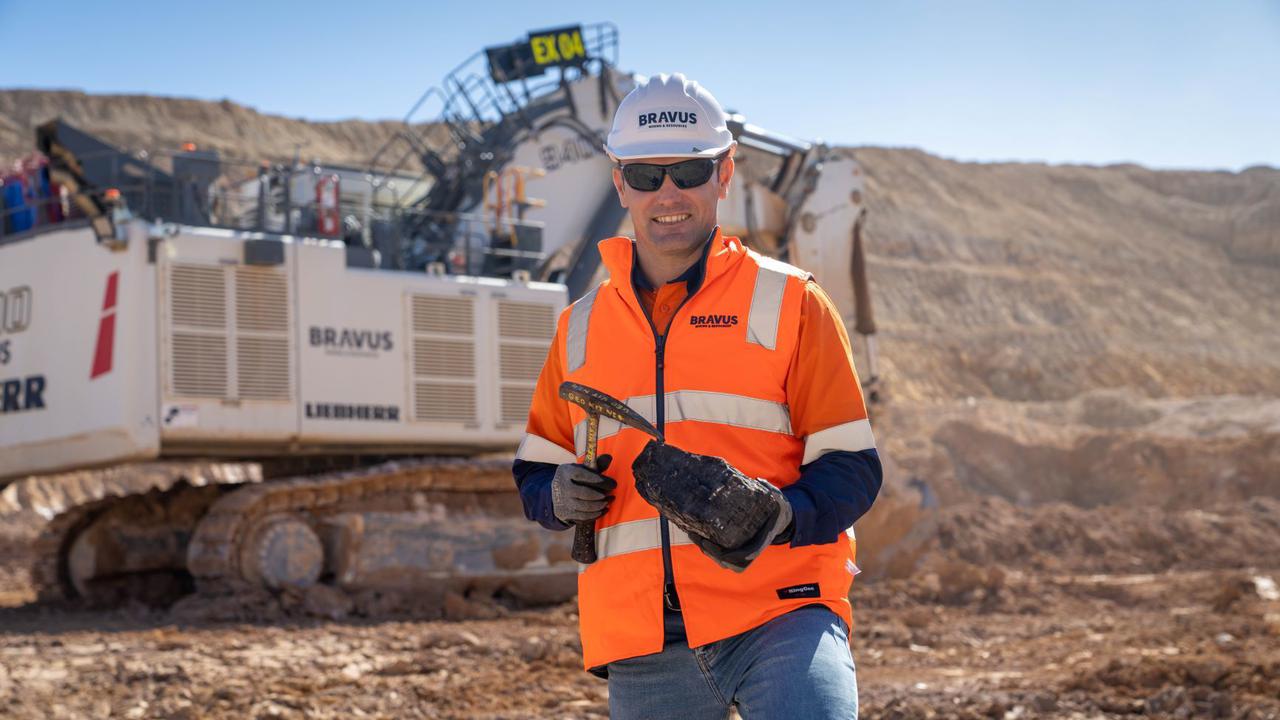 David Boshoff, CEO of Bravus Mining, holds a lump of coal at the Carmichael mine project.