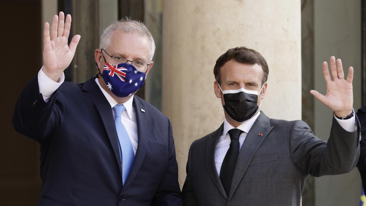 Emmanuel Macron (r) says France stands with Australia against China's economic coercion.