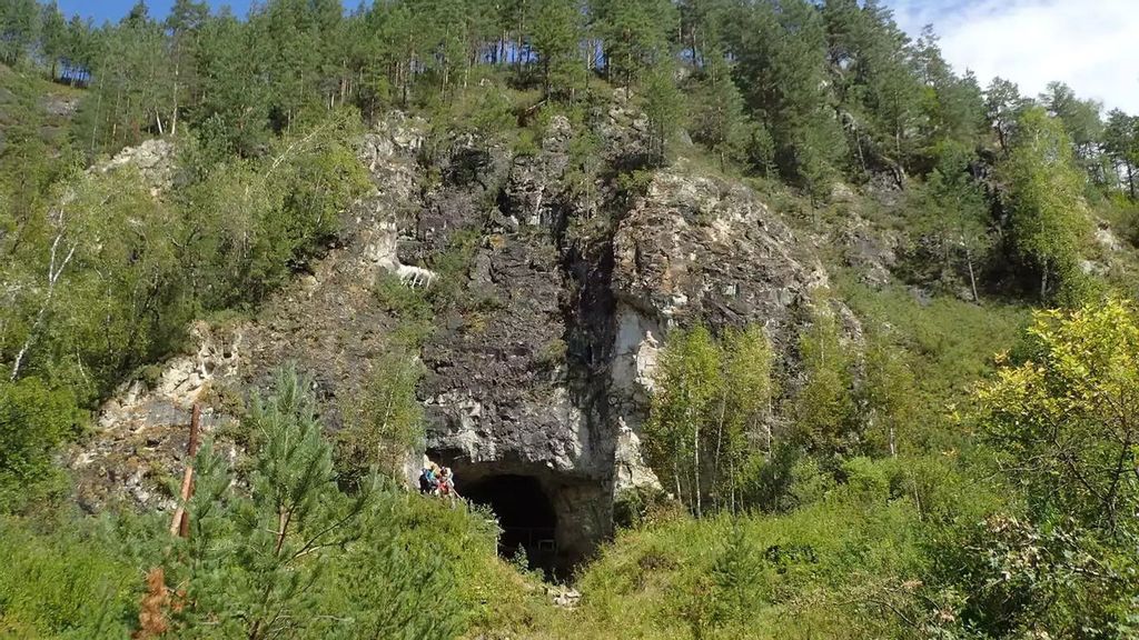 The entrance to Denisova Cave, the famous site in southern Siberia where remains of both Neandertals and their Asian relatives, the Denisovans, have been found. (Richard G. Roberts/Zenger News)