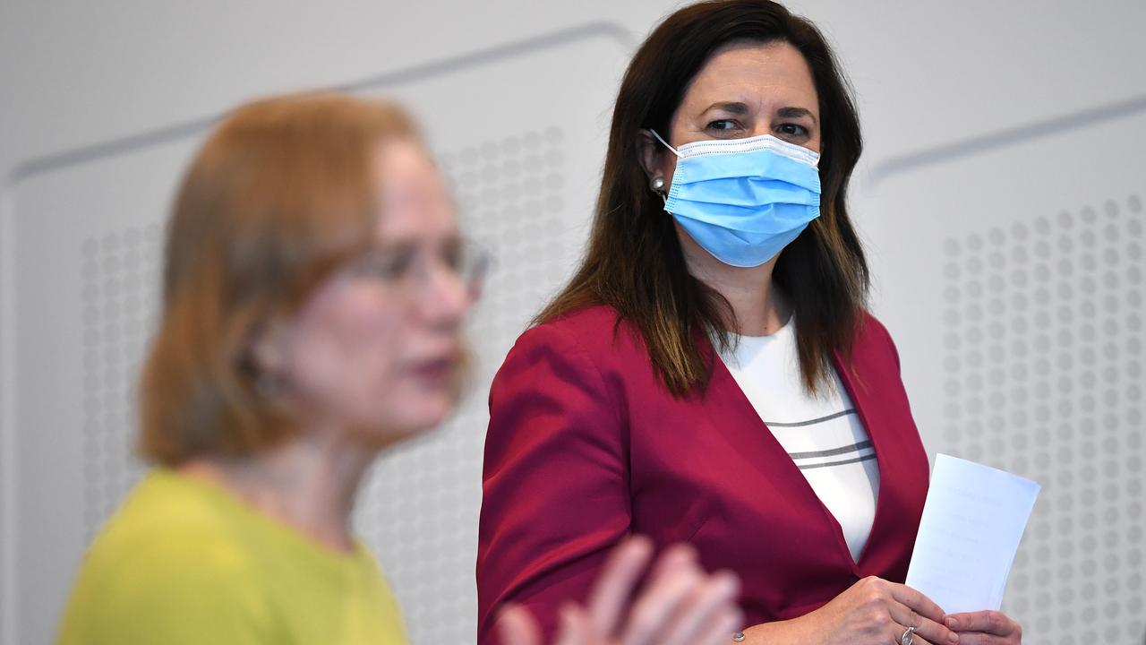 Annastacia Palaszczuk (R) has urged people to abide by social distancing and mask-wearing rules.