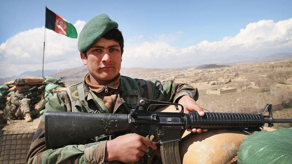 A soldier with the Afghan National Army (ANA) keeps watch from an outpost near Forward Operating Base (FOB) Shank near Pul-e Alam, Afghanistan. (Scott Olson/Getty Images)