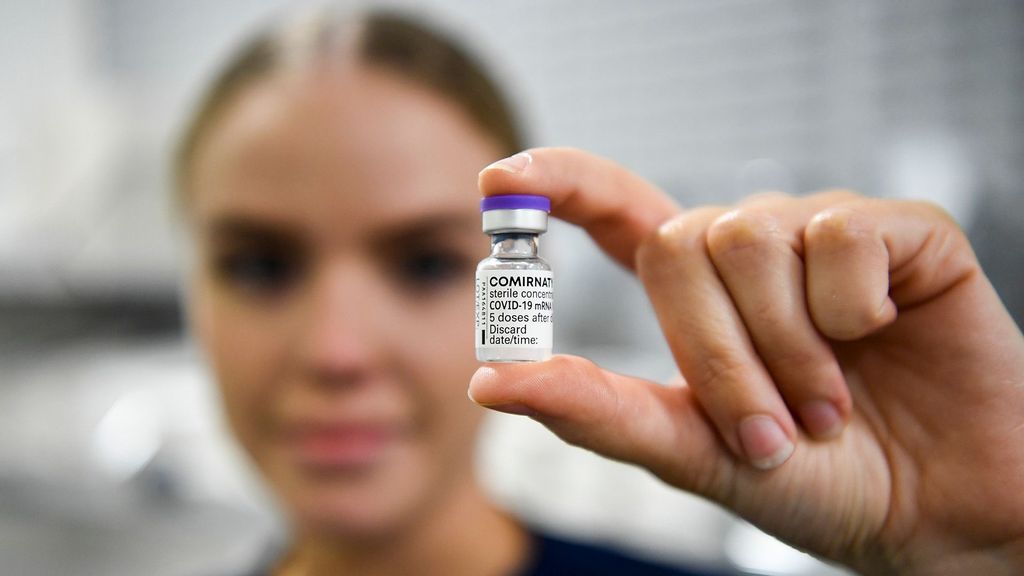 Registered Nurse Christina O'Donnell holds a vial of the Pfizer COVID-19 vaccine. (Ian Hitchcock/QLD Health/Getty Images)