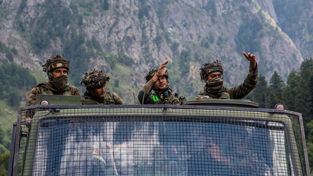 Indian army convoy carrying reinforcement and supplies, drive towards Leh, on a highway bordering China, on September 2, 2020, in Gagangir, India. India and China have stumbled once again into a bloody clash over their shared border. India rushed additional troops to Ladakh after claiming to have foiled what it called China's provocative maneuvers to change the status of Line of Actual Control, the de-facto border between the two countries, in the Himalayan region. As many as 20 Indian soldiers were killed in a violent face-off with Chinese troops in June this year in the Galwan Valley along the Himalayas. Chinese and Indian troops attacked each other with batons and rocks. The deadliest clash since the 1962 India-China war and both have not exchanged gunfire at the border since 1967. Since the recent clash, there has been no sign of a breakthrough. India said its soldiers were killed by Chinese troops when top commanders had agreed to defuse tensions on the Line of Actual Control, the disputed border between the two nuclear-armed neighbours. China rejected the allegations, blaming Indian soldiers for provoking the conflict, which took place at the freezing height of 14,000 feet. The killing of soldiers has led to a call for boycott of Chinese goods in India. (Yawar Nazir/Getty Images)