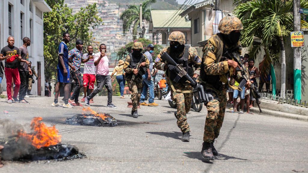 Haitians protest near the police station in Petion Ville a day after President Jovenel Moïse's assassination on July 7 in Port-au-Prince. Haiti remains in turmoil as new authorities are still to be defined and assassins identified. (Richard Pierrin/Getty Images)