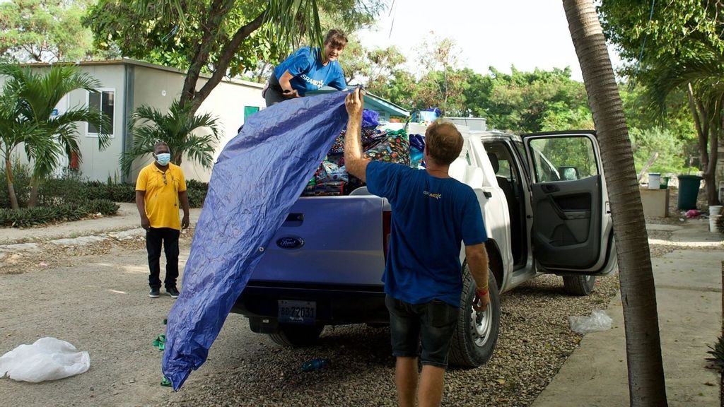 IsraAID’s Dana Yaari and Ben Katzir readying a distribution of essential items following the Haiti earthquake. “I do wish one day to come here as a tour guide and not as an aid worker,” Katzir said. “It is a beautiful country with amazing people, history, culture and food. (Phalonne Pierre-Louis)