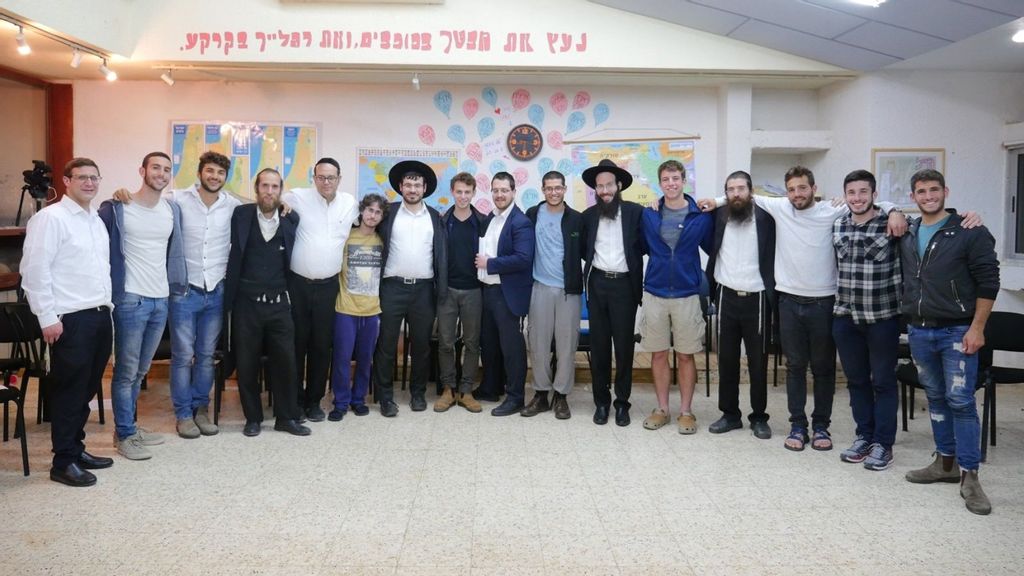 Students at a secular high school with ultra-Orthodox Jewish visitors from the unity project of Be a Mensch Foundation. The foundation is working to give secular high school and post-high school students a rare chance to get acquainted with ultra-Orthodox citizens. (Courtesy of Be a Mensch Foundation)