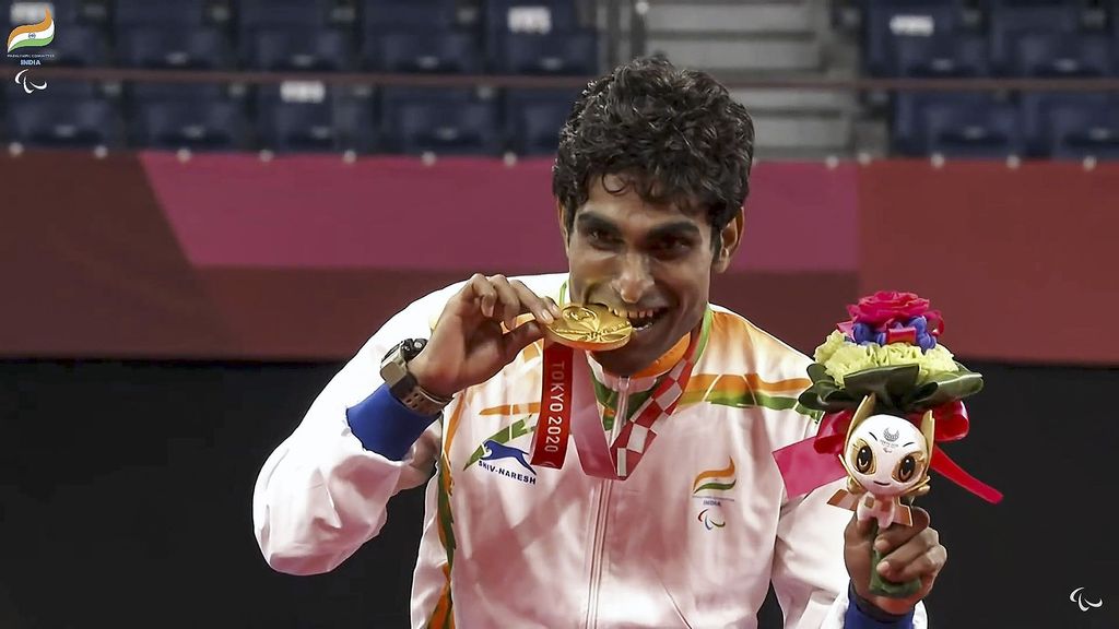 Gold medalist Pramod Bhagat poses on the podium at the medal ceremony for the Men's Singles SL3 of the Tokyo 2020 Paralympic Games in Tokyo, Japan. (Paralympicindia/Youtube)
