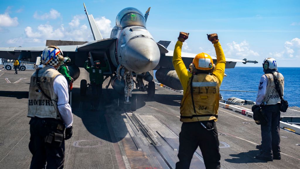 An F/A-18F Super Hornet, assigned to the “Bounty Hunters” of Strike Fighter Squadron (VFA) 2, prepares to launch from the flight deck of Nimitz-class aircraft carrier USS Carl Vinson (CVN 70), Sept. 29, 2021, in the Philippine Sea. Carl Vinson Carrier Strike Group is on a scheduled deployment in the U.S. 7th Fleet area of operations to enhance interoperability through alliances and partnerships. (U.S. Navy photo by Mass Communication Specialist 3rd Class Isaiah Williams)