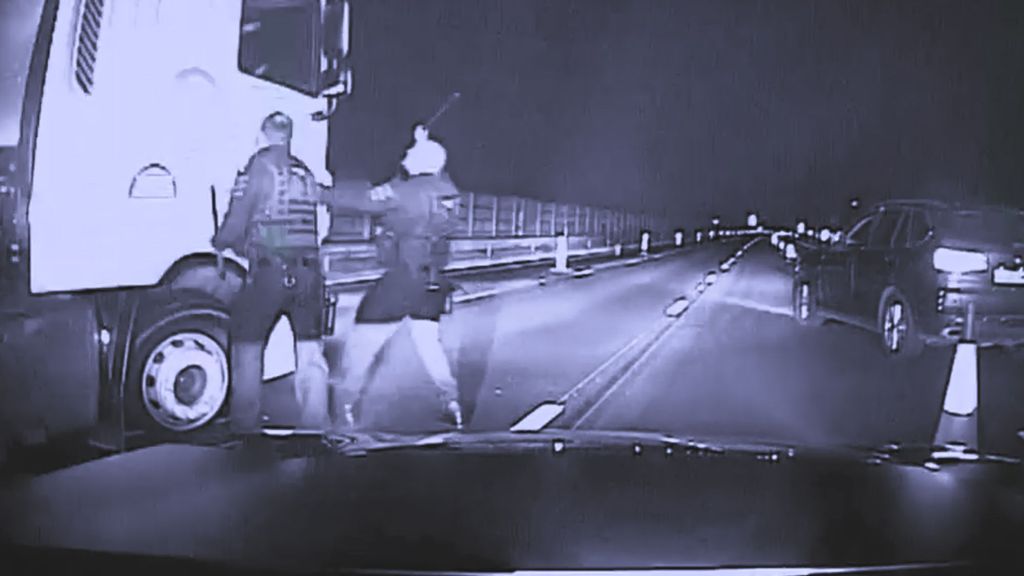 Officers hit the windows of the truck to prevent the suspect, Andrew Champion, from driving away on the M4 highway between southern England and Wales in early May. (Wiltshire Police/Zenger)