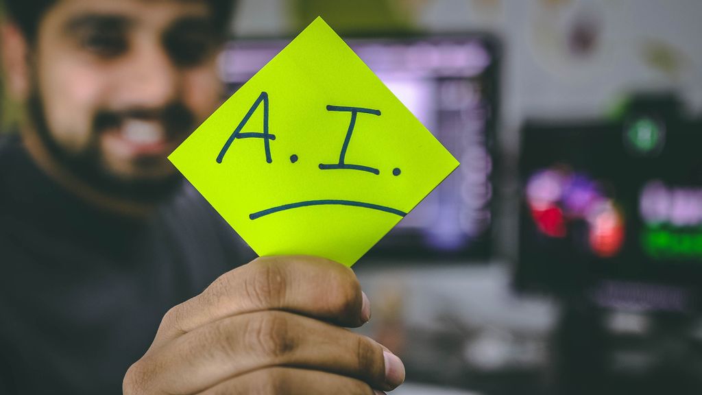 A young tech worker holding a sign of “A.I.” Vice President Kamala Harris voiced her support for AI at a summit in the UK. (HITESH CHOUDHARY/UNSPLASHED)